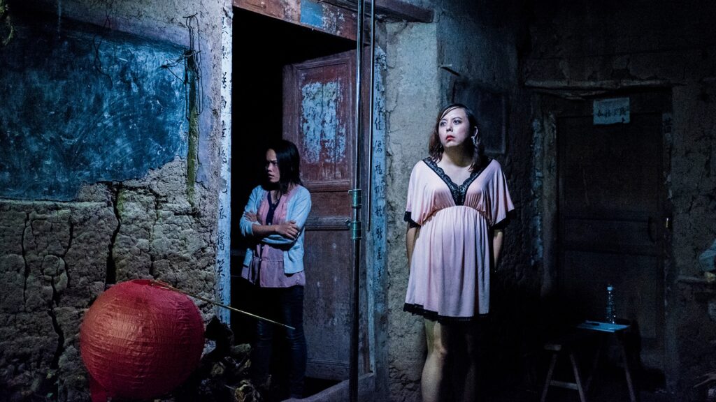Li Wanying (Gu Xiang) and Wang Dandan (Yu Yinmeng), visibly upset, outside an old house – Sunken Plum (2017)