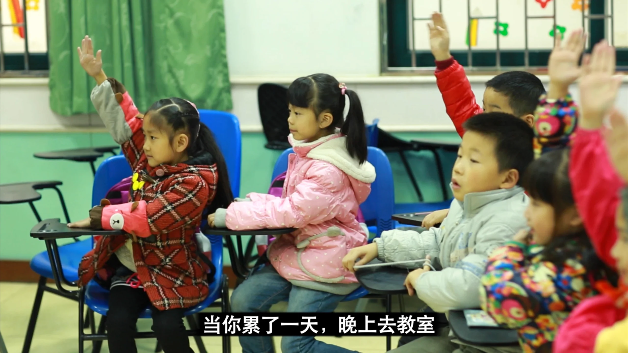 Still from the corporate tribute video for New Oriental School’s 10th anniversary (2013), teachers and staff reflecting on experiences in Beijing, China