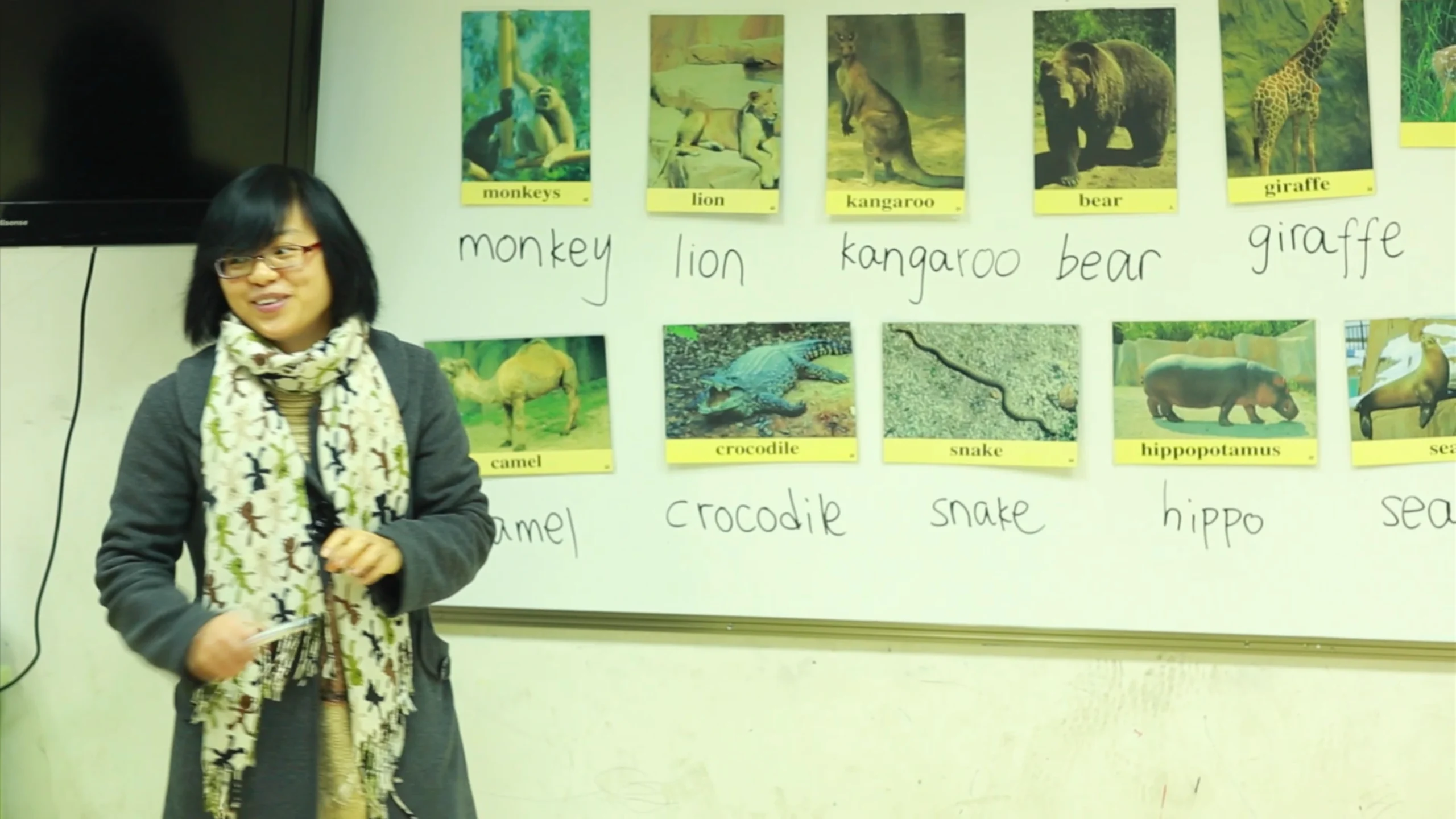 Still from the corporate tribute video for New Oriental School’s 10th anniversary (2013), teachers and staff reflecting on experiences in Beijing, China
