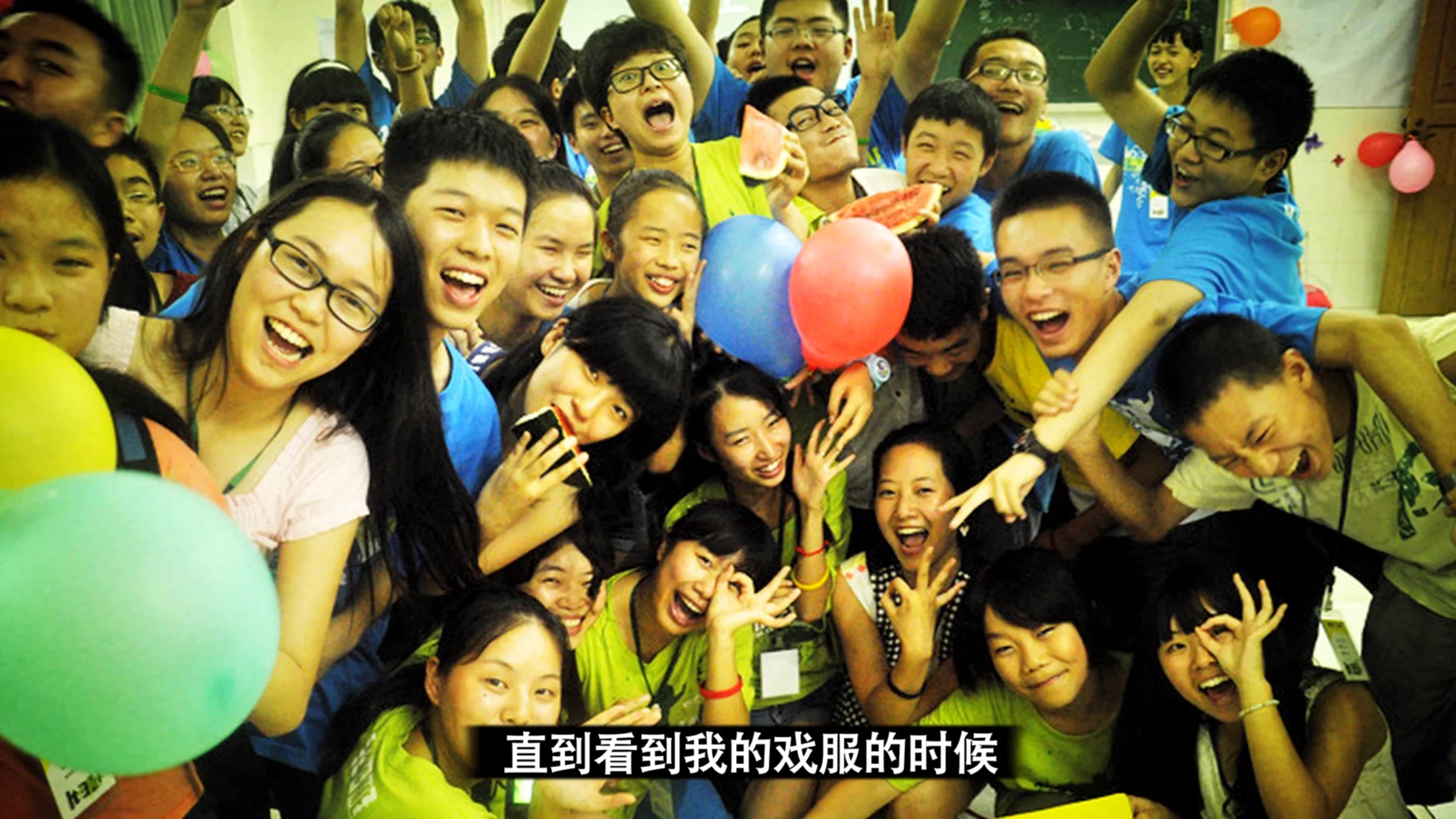 Still from the corporate tribute video for New Oriental School’s 10th anniversary (2013), teachers and staff reflecting on experiences in Beijing, China
