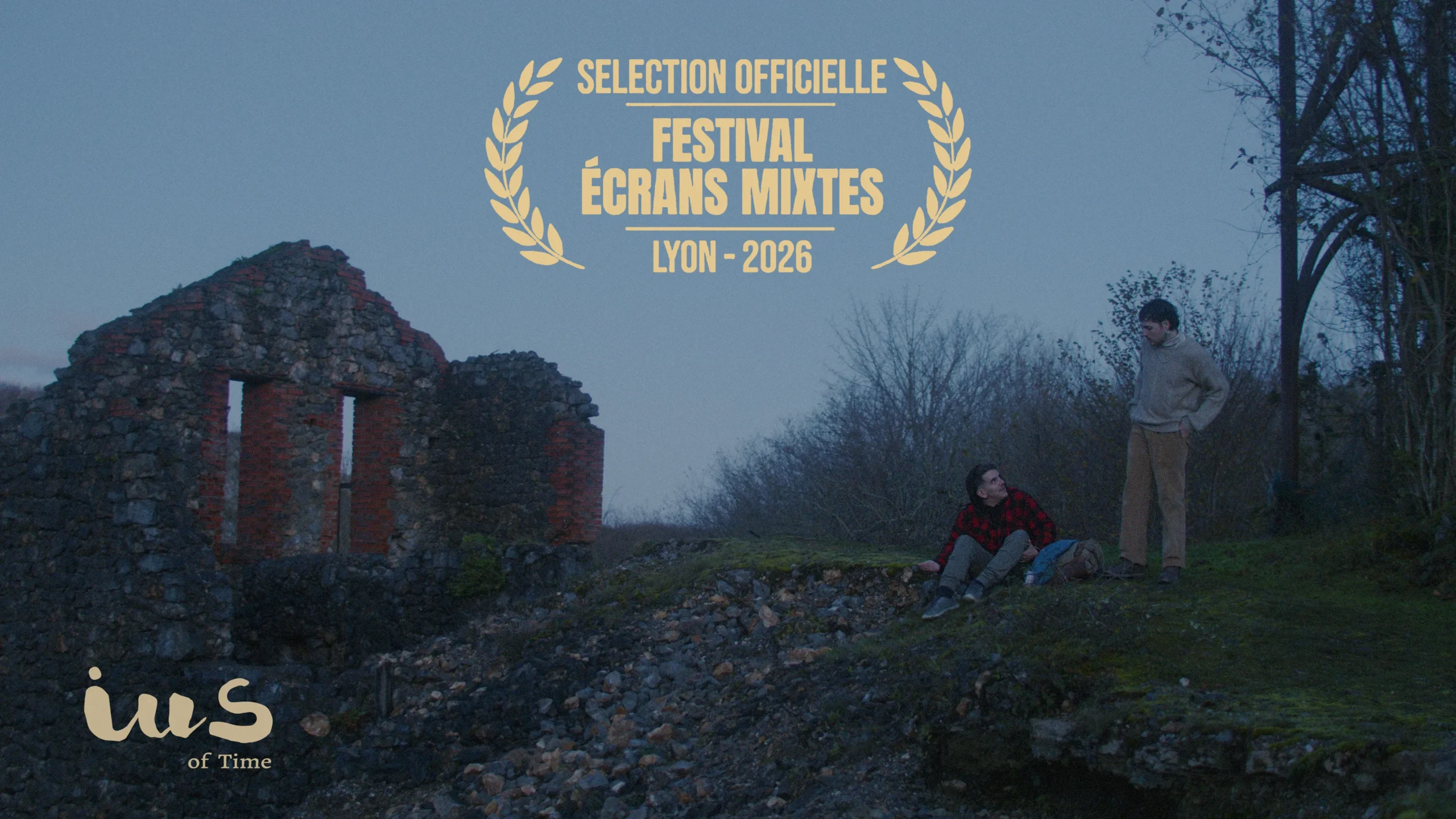 Behind-the-scenes still from IUS of Time showing Luca and Rodri in an abandoned mine in Asturias, with official selection laurel of Écrans Mixtes Queer Film Festival