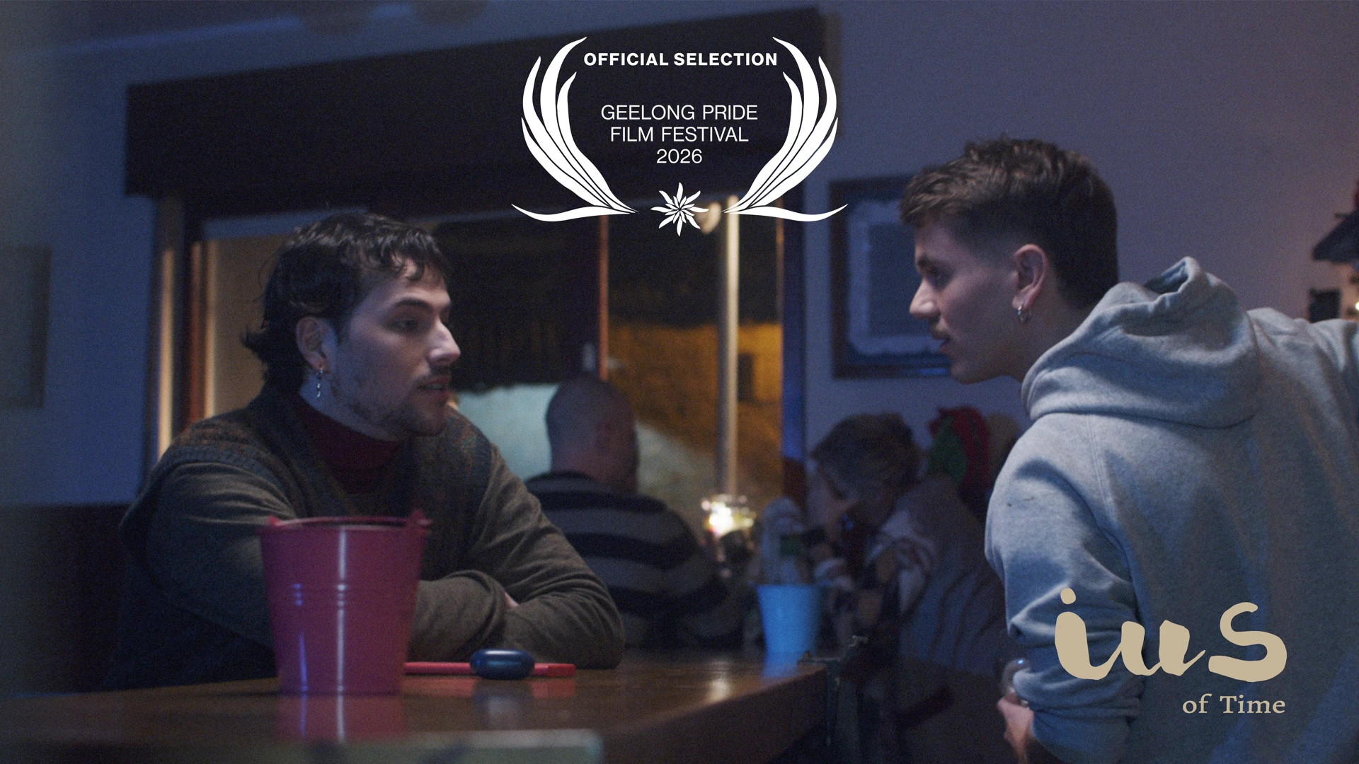 Luca (Pelayo Carrizo) and Rodri (Andy Almar) in a bar scene from IUS of Time with Geelong Pride Film Festival 2026 official selection laurel