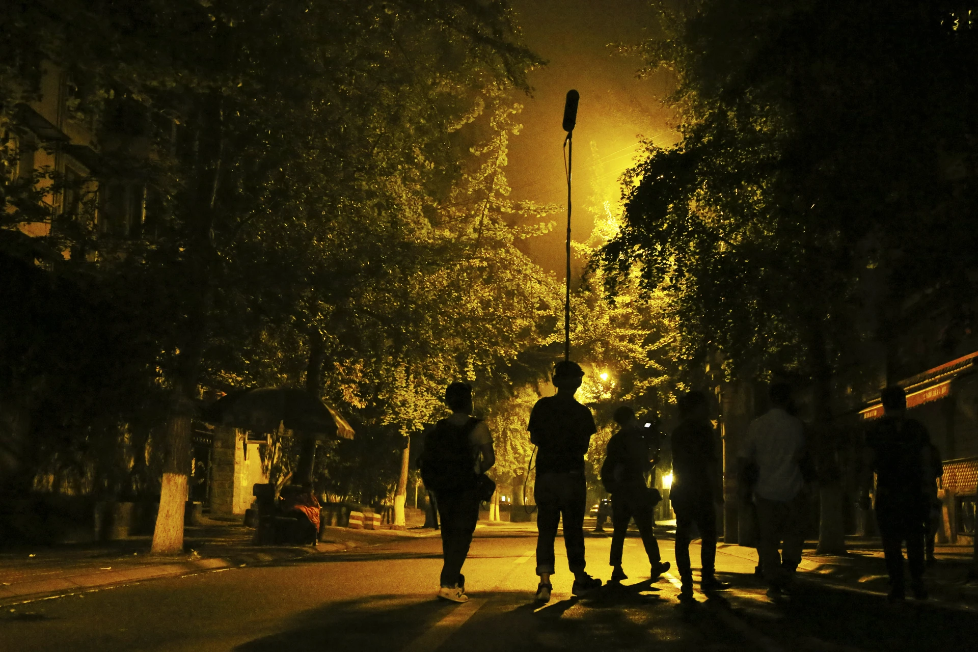 Behind the scenes of Sunken Plum film shoot in Chengdu with directors and crew during nighttime filming