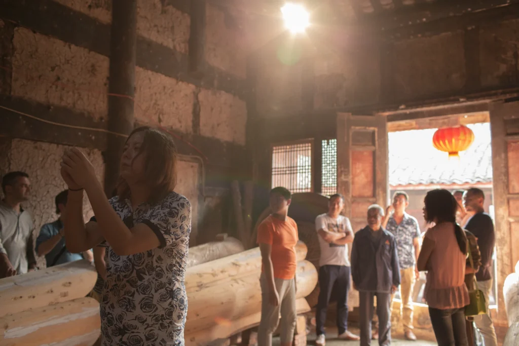 Behind the scenes of Sunken Plum in a rural house with local villagers and coffins
