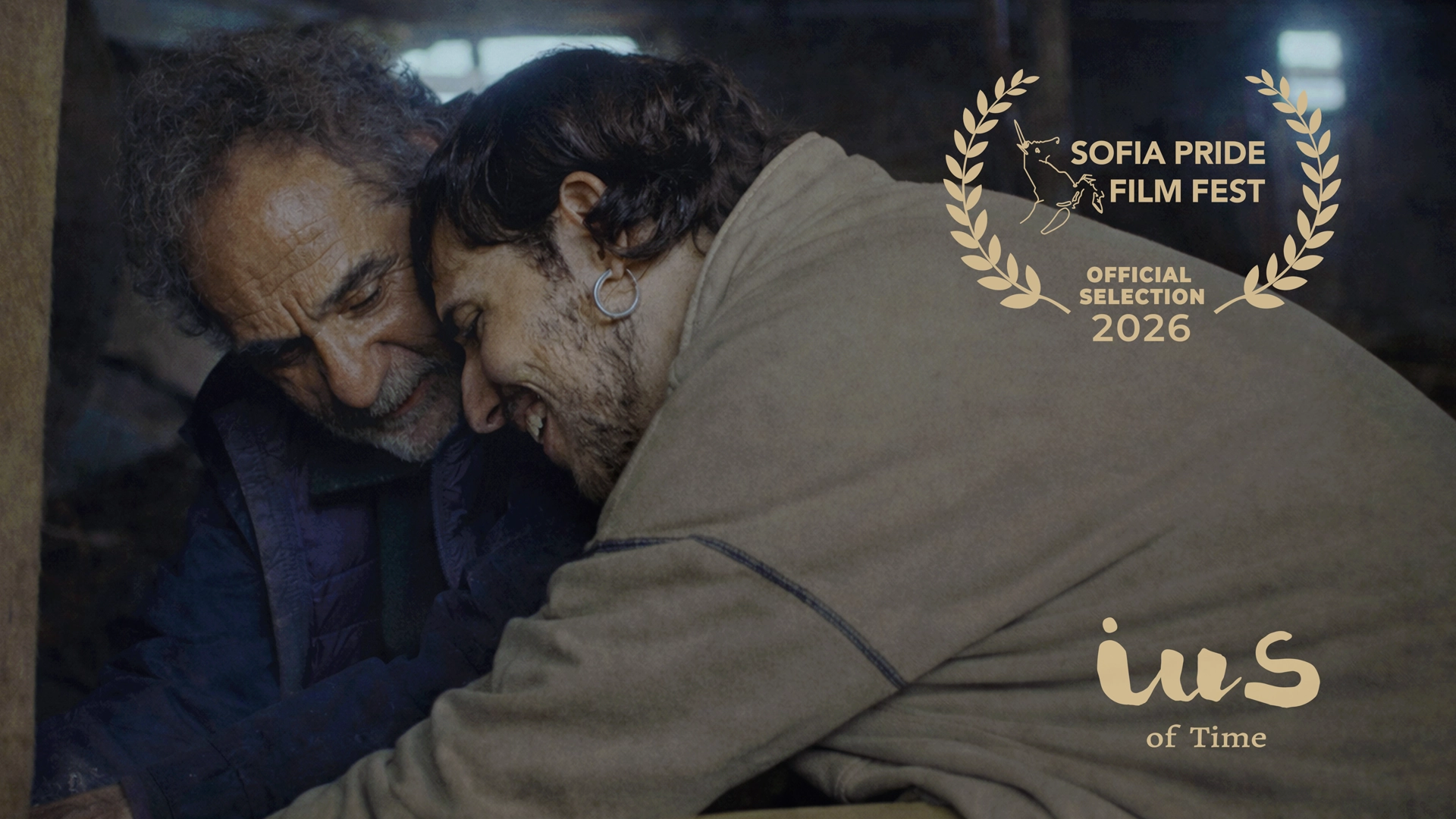 Manuel Pizarro and Pelayo Carrizo embrace in a scene from IUS of Time with the official selection laurel of the 15th Sofia Pride Film Fest 2026